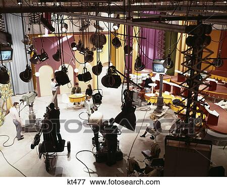 1960S Television Studio With Cameras Lights, Sets, Actors And Technicians Overhead View View Large Photo Image Stock Photo - 1960S Television Studio With Cameras Lights, Sets, Actors And Technicians Overhead View. Fotosearch