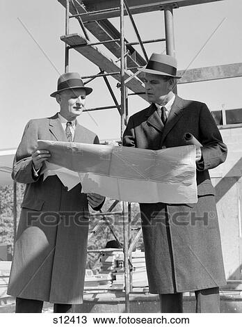 1960S Two Businessmen Reviewing Blueprints At Construction Site Outdoor View Large Photo Image Stock Image - 1960S Two Businessmen Reviewing Blueprints At Construction Site Outdoor . Fotosearch