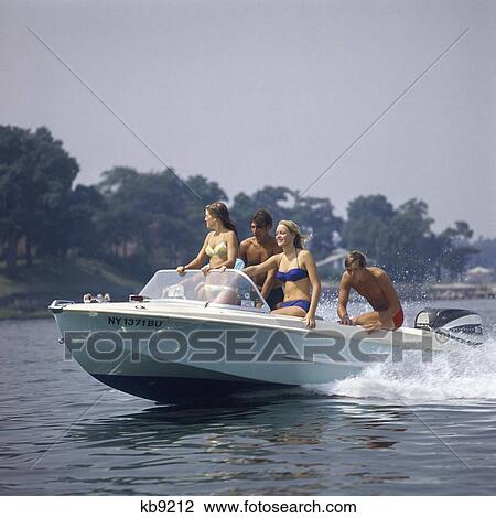 1960S Two Teen Couples In Motorboat Summer Two Piece Bathing Suit Speed Fun Summer Lake Recreation Spray View Large Photo Image Stock Image - 1960S Two Teen Couples In Motorboat Summer Two Piece Bathing Suit Speed Fun Summer Lake Recreation Spray. Fotosearch