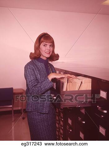 1960S Woman At Office File Cabinet View Large Photo Image Stock Image - 1960S Woman At Office File Cabinet. Fotosearch
