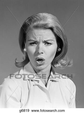 1960S Woman Blonde Hair In Flip Look At Camera Mouth Open Angry Mad Upset Scold Wrinkled Brow Face Expression View Large Photo Image Stock Photo - 1960S Woman Blonde Hair In Flip Look At Camera Mouth Open Angry Mad Upset Scold Wrinkled Brow Face Expression . Fotosearch