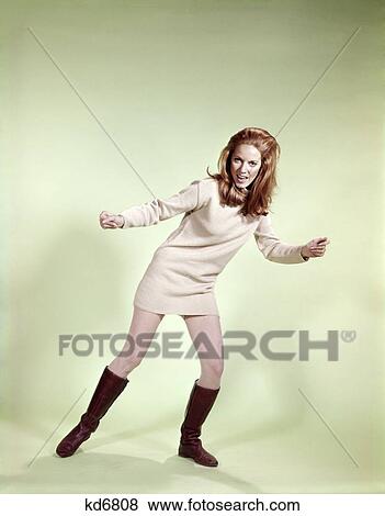 Stock Photo - 1960S Woman Dancer Boots Tan Mini-Skirt Dress Fishnet Stockings Fashion Clothes Retro . Fotosearch