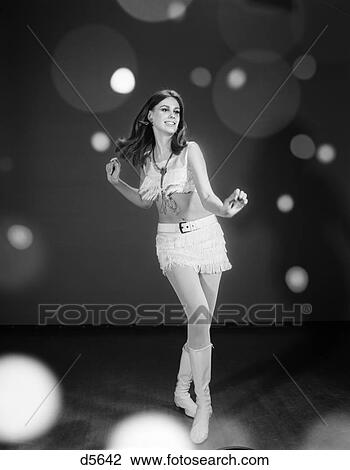 1960S Woman Dancer In White Fringed Halter Top Mini-Dress Skirt & Go-Go Boots Dancing View Large Photo Image Stock Image - 1960S Woman Dancer In White Fringed Halter Top Mini-Dress Skirt & Go-Go Boots Dancing . Fotosearch
