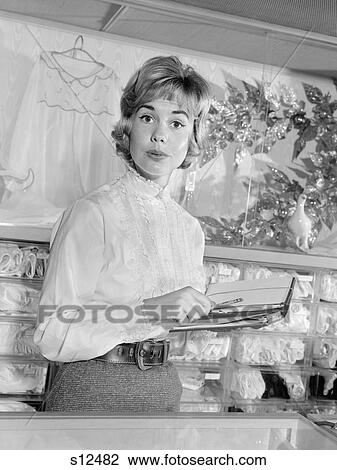 1960S Woman Department Store Sales Clerk Behind Counter Hold Pencil Salesbook Customer Service Retail View Large Photo Image Stock Image - 1960S Woman Department Store Sales Clerk Behind Counter Hold Pencil Salesbook Customer Service Retail. Fotosearch