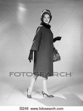 1960S Woman Full Length Pillbox Hat Coat Gloves Fur Collar High Heeled Shoes Handbag Studio Portrait View Large Photo Image Stock Photo - 1960S Woman Full Length Pillbox Hat Coat Gloves Fur Collar High Heeled Shoes Handbag Studio Portrait . Fotosearch