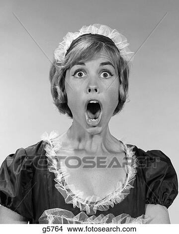 1960S Woman In Maid Uniform Eyes And Mouth Wide Open Flabbergasted Indoor View Large Photo Image Picture - 1960S Woman In Maid Uniform Eyes And Mouth Wide Open Flabbergasted Indoor . Fotosearch