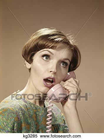 1960S Woman Surprised Expression Talking On Pink Telephone Retro View Large Photo Image Stock Photography - 1960S Woman Surprised Expression Talking On Pink Telephone Retro . Fotosearch