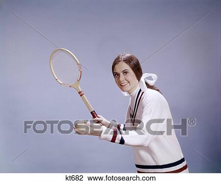 1960S Woman Tennis Player Holding Ball And Racket Ready To Serve Sweater Smiling View Large Photo Image Stock Image - 1960S Woman Tennis Player Holding Ball And Racket Ready To Serve Sweater Smiling. Fotosearch