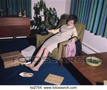 1960S Woman Tired Exhausted In Living Room Chair Sore Feet Shoes Off Shopping Bags All Around View Large Photo Image Picture - 1960S Woman Tired Exhausted In Living Room Chair Sore Feet Shoes Off Shopping Bags All Around . Fotosearch