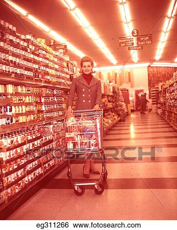 1960S Woman With Shopping Cart In Supermarket Aisle View Large Photo Image Stock Photograph - 1960S Woman With Shopping Cart In Supermarket Aisle. Fotosearch