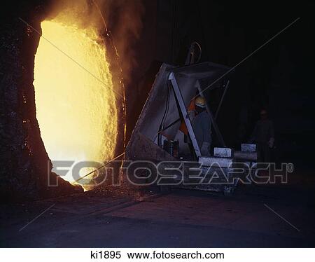 1960S Workman Behind Protective Shield Tests Mixture In Blast Furnace In Steel Mill Heat Molten Metal Retro Vintage View Large Photo Image Stock Photography - 1960S Workman Behind Protective Shield Tests Mixture In Blast Furnace In Steel Mill Heat Molten Metal Retro Vintage. Fotosearch