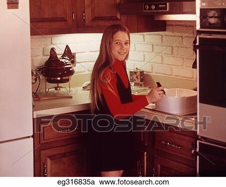 1960S Young Girl Cooking In Kitchen View Large Photo Image Stock Image - 1960S Young Girl Cooking In Kitchen. Fotosearch