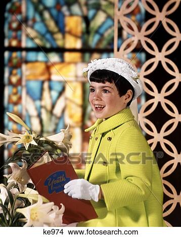 Picture - 1960S Young Girl Easter Sunday Clothes Green Coat Shite Bonnet Hat Gloves Holding Church Hymnal . Fotosearch