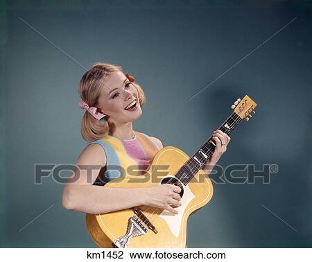1960S Young Girl Playing Guitar View Large Photo Image Stock Image - 1960S Young Girl Playing Guitar. Fotosearch