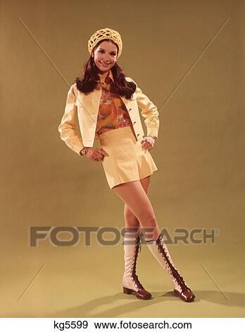 1960S Young Woman In Mini Skirt With Paisley Blouse And Shiny Gold Boots Studio View Large Photo Image Stock Photo - 1960S Young Woman In Mini Skirt With Paisley Blouse And Shiny Gold Boots Studio . Fotosearch