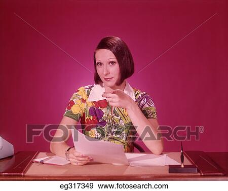 1970S Woman At Desk Colorful Blouse Pointing Towards Camera View Large Photo Image Stock Photo - 1970S Woman At Desk Colorful Blouse Pointing Towards Camera. Fotosearch