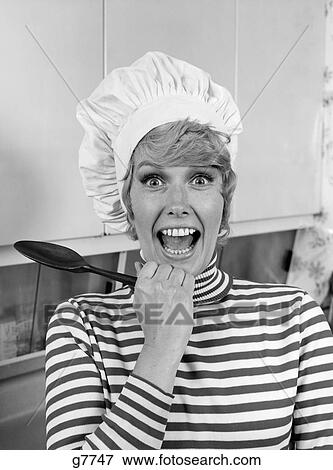 1970S Woman Portrait Wearing Chef'S Toque In Kitchen With Surprised Face View Large Photo Image Stock Photo - 1970S Woman Portrait Wearing Chef'S Toque In Kitchen With Surprised Face . Fotosearch