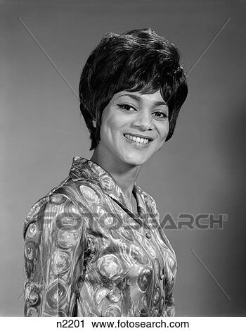 African-American Black Woman 3 4 Pose Toward Camera Smile Short Hair Teeth Blouse Loud Busy Design 1960S Retro View Large Photo Image Stock Image - African-American Black Woman 3 4 Pose Toward Camera Smile Short Hair Teeth Blouse Loud Busy Design 1960S Retro. Fotosearch