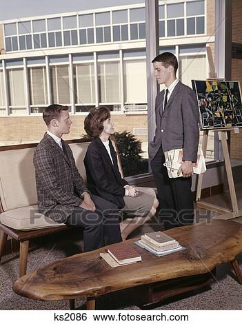 Stock Photograph - College Students Office Meeting Young Men And Woman 1960 1960S Retro. Fotosearch