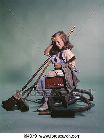 Stock Photo - Girl With Cleaning Supplies Vacuum Dust Pan Brooms. Fotosearch