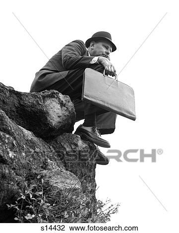 Man Salesman Sitting On Rock Ledge Cliff Wearing Suit Hat Briefcase Worried Anxious Concerned 1960S View Large Photo Image Stock Image - Man Salesman Sitting On Rock Ledge Cliff Wearing Suit Hat Briefcase Worried Anxious Concerned 1960S. Fotosearch