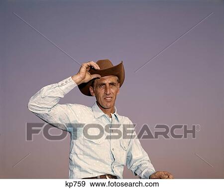 Portrait Man Cowboy Hat Tilt 1960 1960S Retro View Large Photo Image Stock Photo - Portrait Man Cowboy Hat Tilt 1960 1960S Retro. Fotosearch