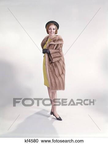 Retro 1960S 1960 Woman In Yellow Dress Black Hat Gloves Shoes Pearl Necklace Fur Coat View Large Photo Image Stock Image - Retro 1960S 1960 Woman In Yellow Dress Black Hat Gloves Shoes Pearl Necklace Fur Coat. Fotosearch