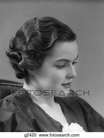 1930s 1940s thoughtful brunette woman in profile with wavy hair View Large Photo Image Stock Image - 1930s 1940s thoughtful brunette woman in profile with wavy hair. Fotosearch