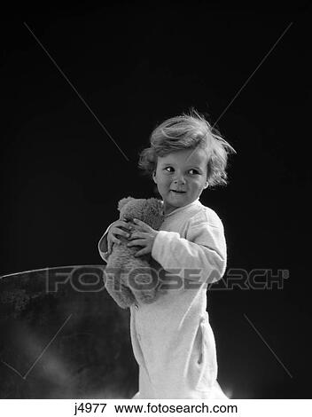 1930s boy toddler holding teddy bear View Large Photo Image Stock Photo - 1930s boy toddler holding teddy bear. Fotosearch