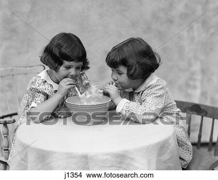 1930s two girls playing with pipes smoke View Large Photo Image Picture - 1930s two girls playing with pipes smoke. Fotosearch