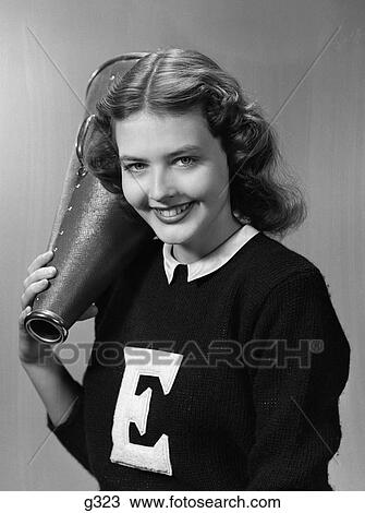 1940s 1950s girl cheerleader with megaphone smiling View Large Photo Image Stock Image - 1940s 1950s girl cheerleader with megaphone smiling. Fotosearch