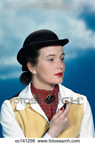 1940s 1950s portrait teen girl wearing equestrian outfit derby hat