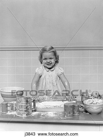 1940s child baking playing rolling pin flour dough View Large Photo Image Stock Image - 1940s child baking playing rolling pin flour dough. Fotosearch