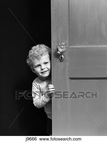 1940s child peering looking around door View Large Photo Image Stock Photograph - 1940s child peering looking around door. Fotosearch