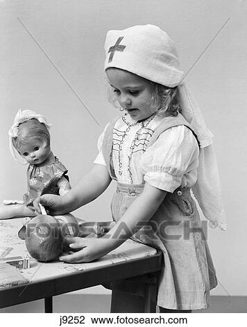 1940s child playing dolls nurse View Large Photo Image Stock Image - 1940s child playing dolls nurse. Fotosearch