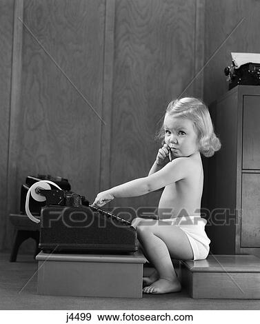 1940s child sitting playing typing on typewriter View Large Photo Image Stock Photo - 1940s child sitting playing typing on typewriter. Fotosearch