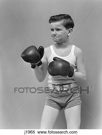 1940s child wearing boxing gloves standing View Large Photo Image Stock Photography - 1940s child wearing boxing gloves standing. Fotosearch