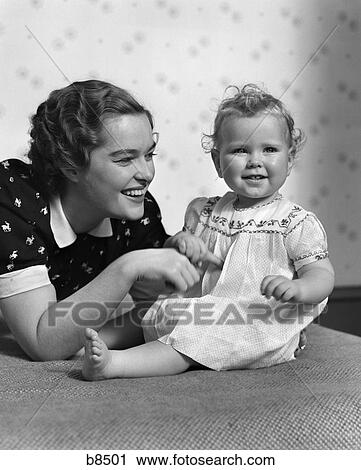 1940s smiling mother and happy child View Large Photo Image Stock Image - 1940s smiling mother and happy child. Fotosearch