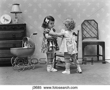 1940s two girls playing with dolls taking View Large Photo Image Stock Photography - 1940s two girls playing with dolls taking. Fotosearch