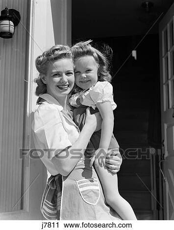 1940s woman holding child girl daughter smiling View Large Photo Image Stock Image - 1940s woman holding child girl daughter smiling. Fotosearch