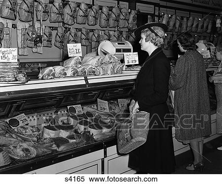 1940s women in butcher shop at display case of meats View Large Photo Image Stock Photography - 1940s women in butcher shop at display case of meats. Fotosearch