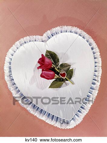 1950s 1960s heart shaped box covered with blue satin lace trim two red roses valentine romance View Large Photo Image Stock Image - 1950s 1960s heart shaped box covered with blue satin lace trim two red roses valentine romance. Fotosearch