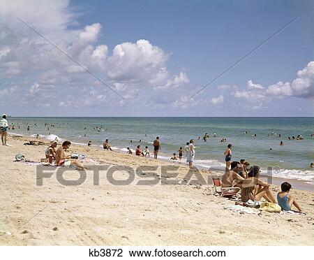 1950s 1960s people beach crowd hanlover beach florida View Large Photo Image Stock Image - 1950s 1960s people beach crowd hanlover beach florida. Fotosearch