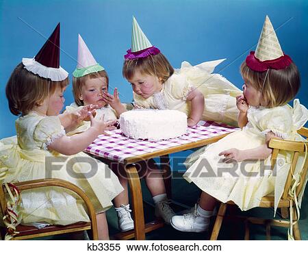 1950s 1960s quadruplets 4 red haired girls wearing party hats and dresses sitting table birthday cake View Large Photo Image Stock Photography - 1950s 1960s quadruplets 4 red haired girls wearing party hats and dresses sitting table birthday cake. Fotosearch