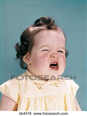 1950s 1960s unhappy crying baby mouth open showing new teeth teething pain View Large Photo Image Stock Photograph - 1950s 1960s unhappy crying baby mouth open showing new teeth teething pain. Fotosearch