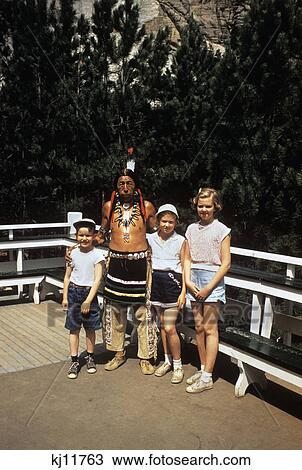 1950s boy and two little girls posing with an native american indian mount rushmore View Large Photo Image Stock Image - 1950s boy and two little girls posing with an native american indian mount rushmore. Fotosearch