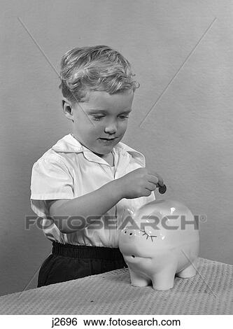 1950s child putting coin money into piggy bank View Large Photo Image Stock Photograph - 1950s child putting coin money into piggy bank. Fotosearch