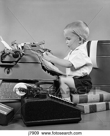 1950s child typing sitting typewriter View Large Photo Image Stock Photo - 1950s child typing sitting typewriter. Fotosearch