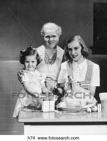 1950s family kitchen mother daughter grandmother dinner food View Large Photo Image Picture - 1950s family kitchen mother daughter grandmother dinner food. Fotosearch