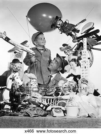 1950s father with son holding balloon surrounded by toys & stuffed animals View Large Photo Image Stock Photograph - 1950s father with son holding balloon surrounded by toys & stuffed animals. Fotosearch